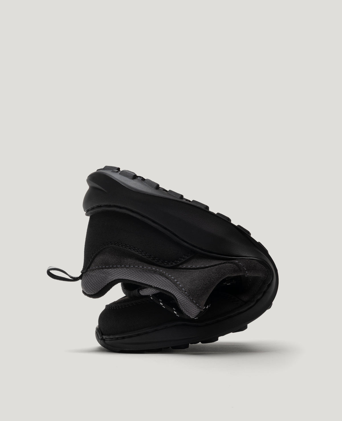 ZERO GRIT Fossil barefoot sneaker folded in half to show its flexible sole